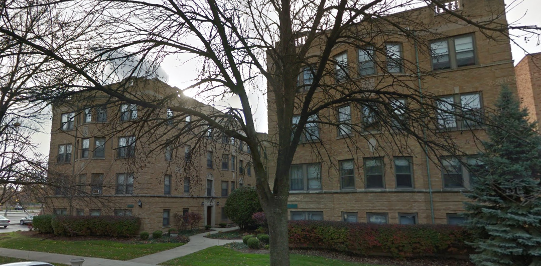 This kind of multifamily building, common in the city, is just a few blocks from suburban Elmhurst, IL's downtown Metra station. It was built probably only a few years before the adoption of zoning codes that made this sort of construction illegal, and enforced a low-density development pattern on the area. Credit: Google Streetview